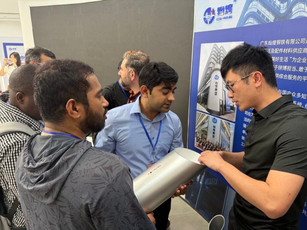 Foreign customers visiting Canhope Steel showroom — cable tray and galvanized pipe manufacturer in China