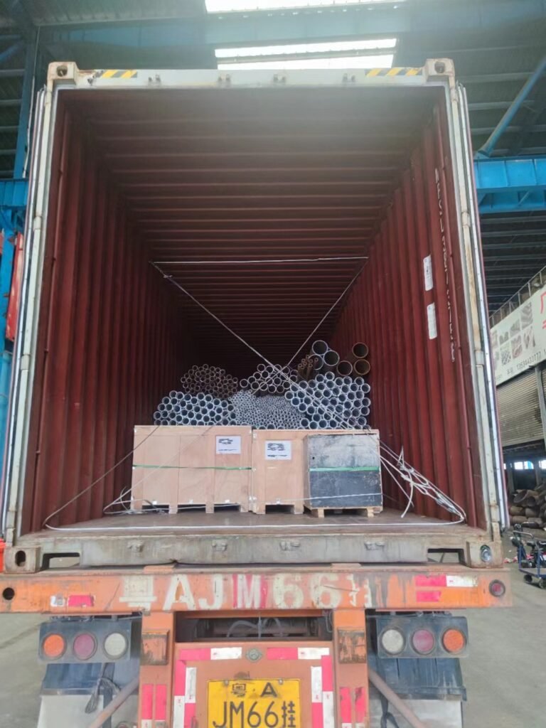 steel container loading arrangement with pipes and sheets
