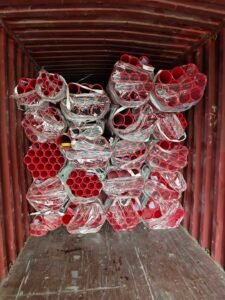Prefabricated red coated fire pipes container loading for export to Cambodia paint factory project