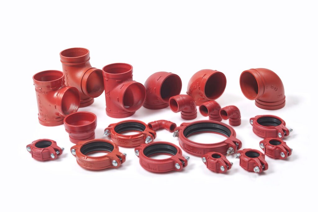 Grooved pipe fittings including couplings, elbows, tees and reducers for fire protection piping systems