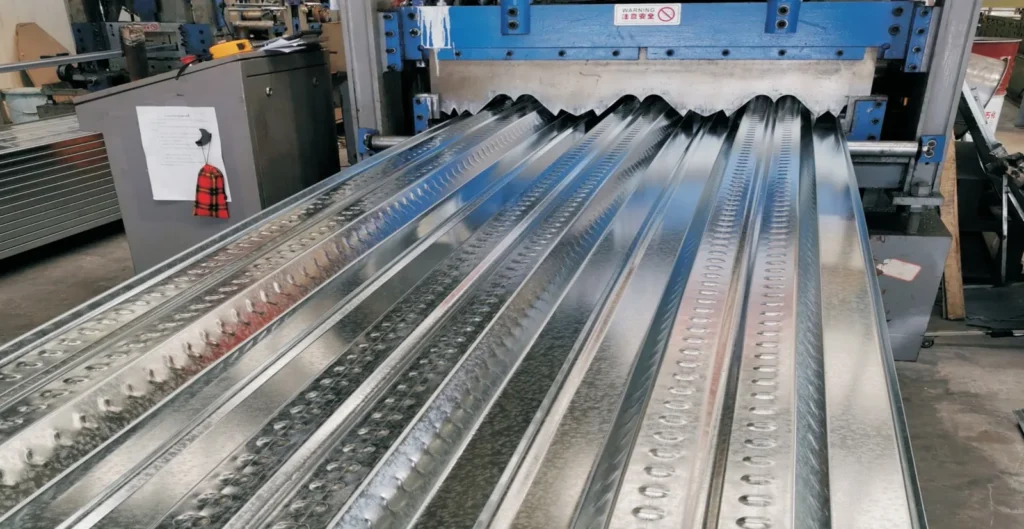 Galvanized steel floor deck being roll formed at the CanHope Steel processing plant